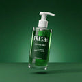 Green bottle with pump labeled 'Fresh Labs' on a green background