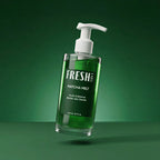Green bottle with pump labeled 'Fresh Labs' on a green background