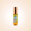 A roll-on body mist bottle with a metallic rose gold cap and a label that reads 'Swiss Mist BODY MIST' and 'Sweet Cherry' in gold script, set against a light beige background.