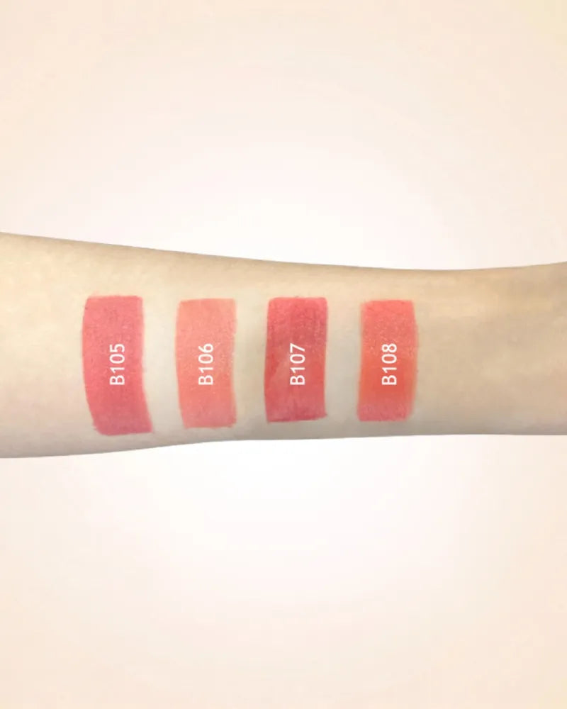 Arm swatches comparing Swiss Miss lipstick shades B105, B106, B107, and B108.