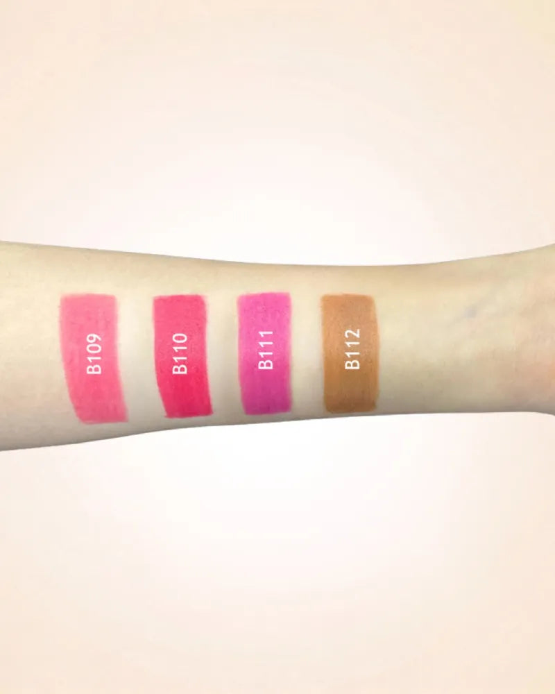 Arm swatches comparing Swiss Miss lipstick shades B109, B110, B111, and B112.