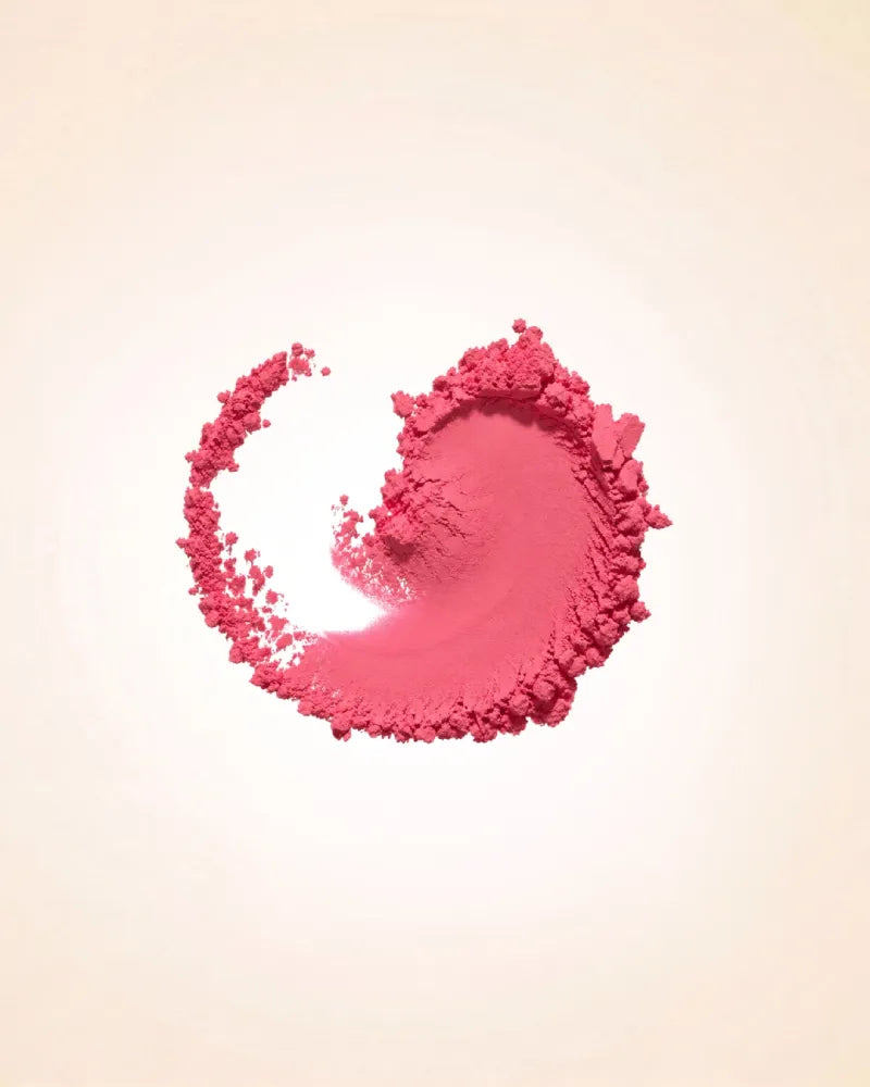 Circular crushed powder swatch displaying the bright pink pigment and smooth matte texture of Swiss Miss Blush in Romantic Pink SM 003