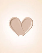 Heart-shaped liquid texture swatch of Swiss Miss Matte and Poreless CC Concealer in shade Fine Plush SM 03