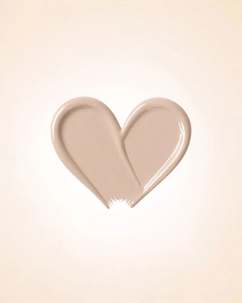 Heart-shaped liquid texture swatch of Swiss Miss Matte and Poreless CC Concealer in shade Fine Plush SM 03