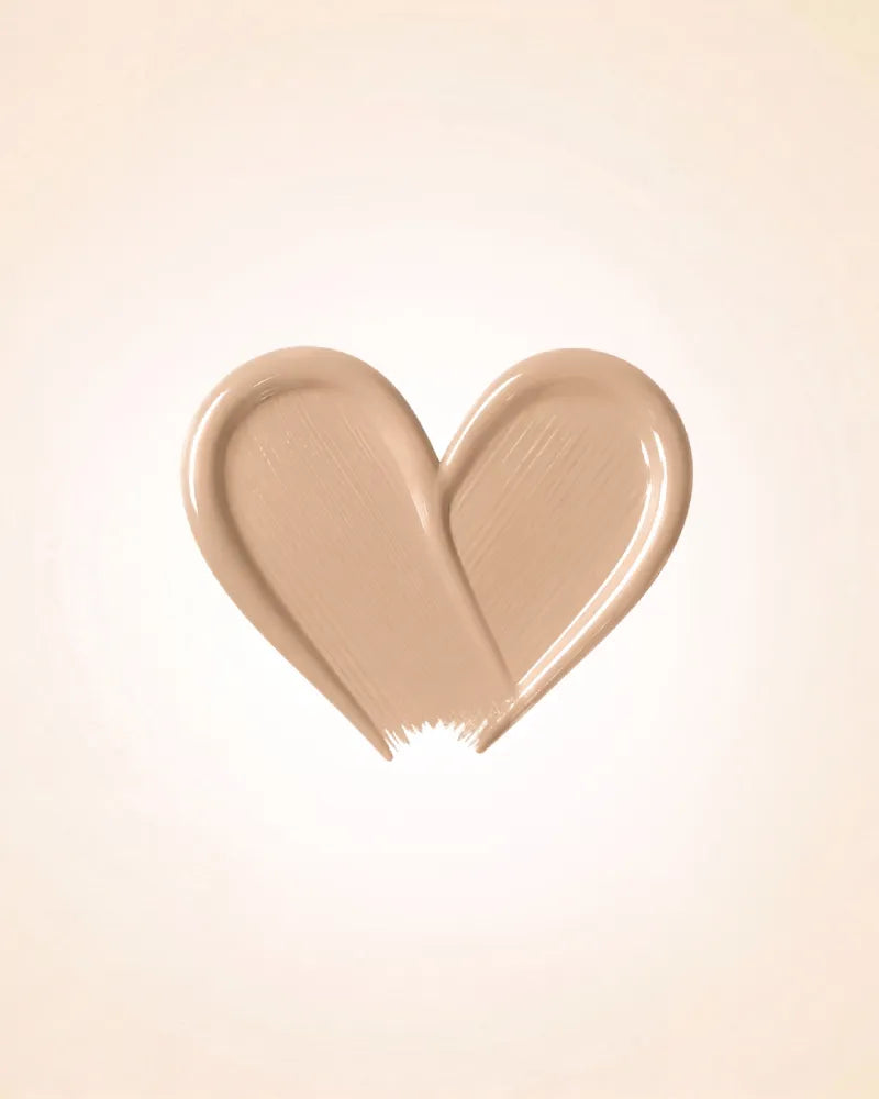 Heart-shaped liquid texture swatch of Swiss Miss Matte and Poreless CC Concealer in shade Peachy Pink SM 04