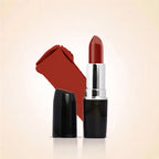 Swiss Miss Classic Lipstick in Amber Aura M-524 open bullet tube displayed next to a rich warm red color swatch streak.