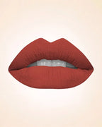 Lip swatch application of Swiss Miss Classic Lipstick in shade Burnt Peach M-50 showing a smooth terracotta nude lip finish.