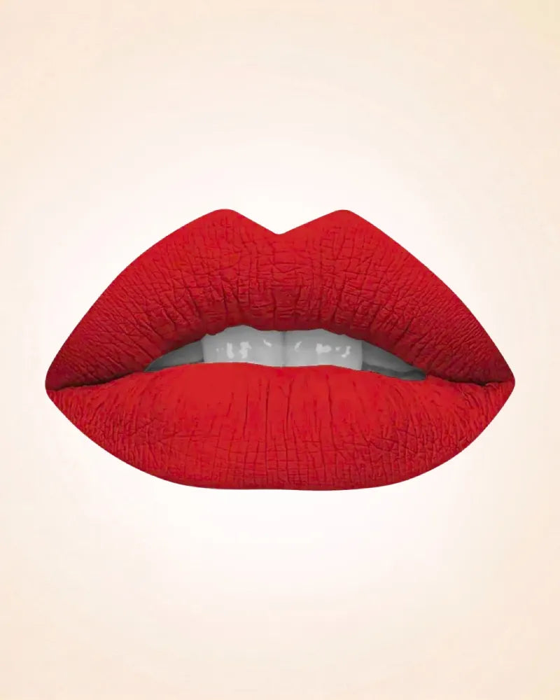 Lip swatch application of Swiss Miss Classic Lipstick in shade Cherry Pop M-24 showing a rich classic red finish.