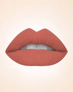 Close-up lip swatch of Swiss Miss Classic Lipstick in Cocoa Crush M-518 shade.