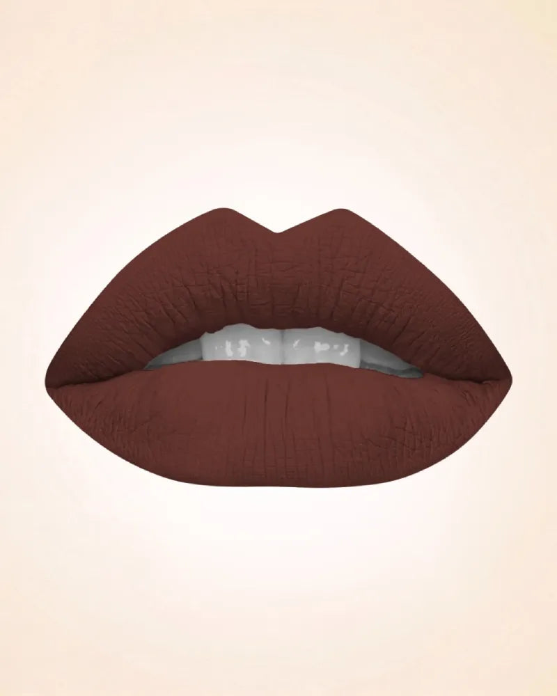 Close-up lip swatch of Swiss Miss Classic Lipstick in Dark Chocolate M-223 shade.