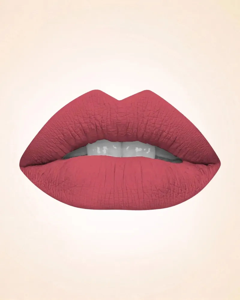 Close-up lip swatch of Swiss Miss Classic Lipstick in Flamingo Pink M-228 shade.