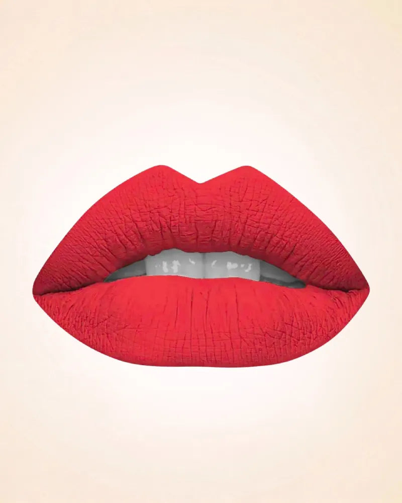 Lip swatch application of Swiss Miss Classic Lipstick in shade Pink M-39 showing a rich coral pink lip finish.