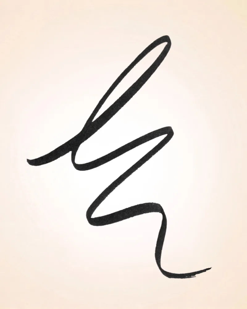 Smooth continuous black stroke swatch demonstrating the pigment payout and fine precision of Swiss Miss Marker Eyeliner.