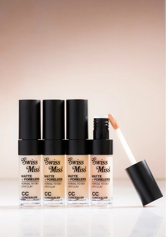 Swiss Miss Matte and Poreless CC Concealer shade lineup showing clear tubes with black caps and applicator wand