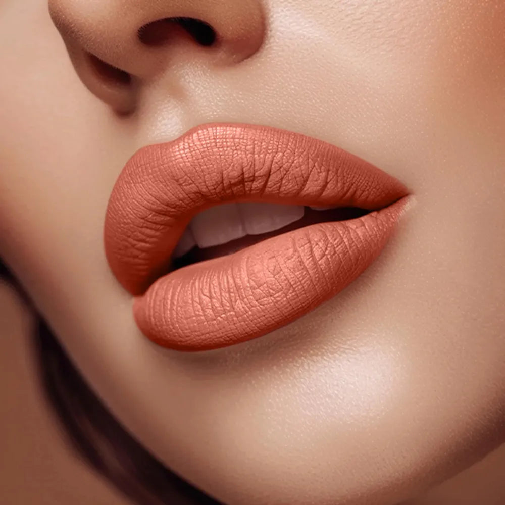 Close-up of lips wearing Swiss Miss Nude Pink B-103 matte lipstick shade.