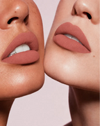 Close-up shot of two models with different skin tones wearing Swiss Miss Silk Lipstick in shade Caramel Nude (703).
