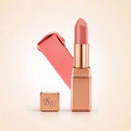 Swiss Miss Silk Lipstick in shade Honey Pink (702) in gold bullet packaging shown alongside a textured cream color swatch.