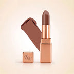 Swiss Miss Silk Lipstick in shade Rich Roast (731) in gold bullet packaging shown alongside a textured cream color swatch.