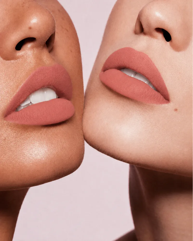 Close-up shot of two models with different skin tones wearing Swiss Miss Silk Lipstick in shade Rose Taupe (706).