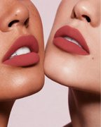 Close-up shot of two models with different skin tones wearing Swiss Miss Silk Lipstick in shade Rouge Pink (714).