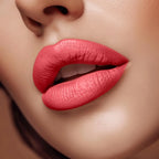 Close-up of lips wearing Swiss Miss Soar Pink B-108 matte lipstick shade.