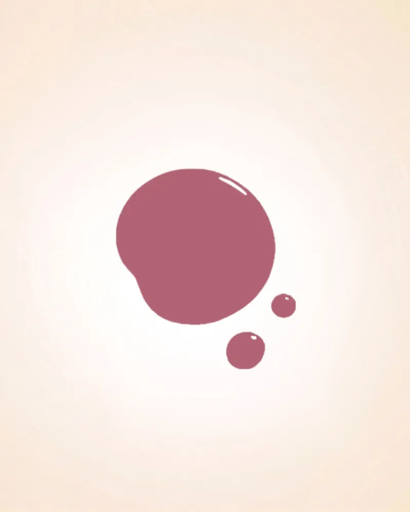 Glossy liquid nail polish drop swatch in shade Sugar Pink 209 showing texture and coverage.