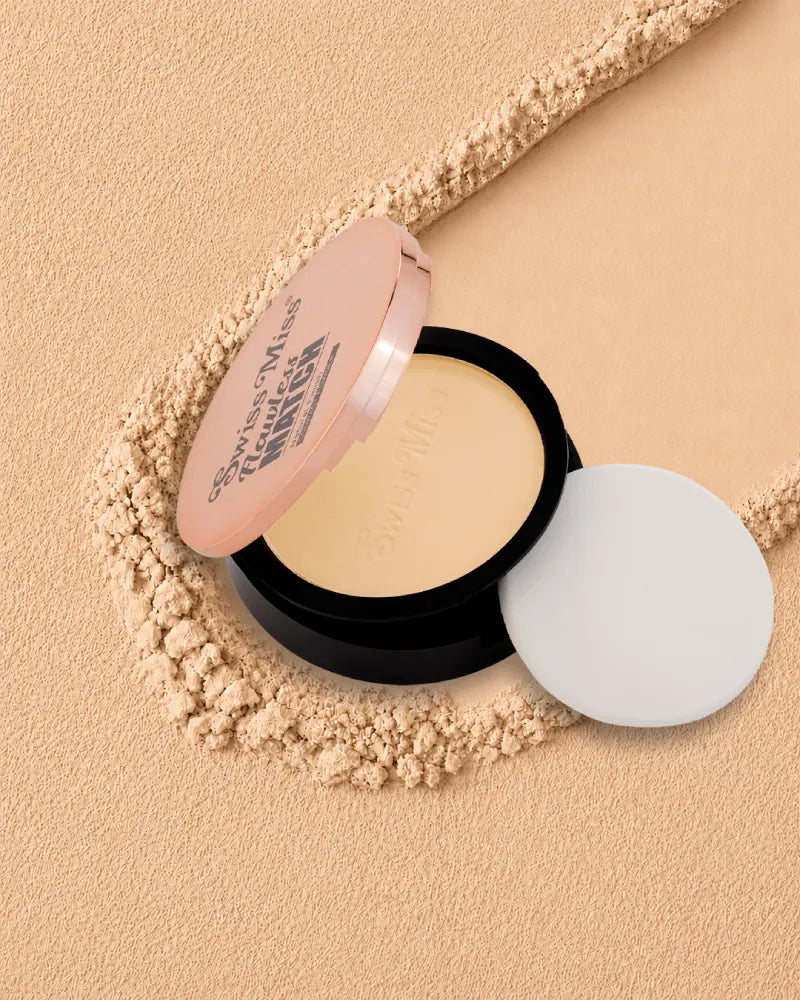 Swiss Miss Flawless Match Compact Powder open case with sponge applicator in shade Fine Ivory SM 02 over a textured powder background